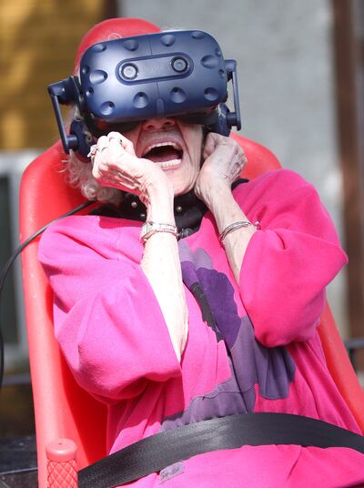 Barbara Sollie, 95, reacts to “Montezuma's Treasure Ride,” an Innovative Entertainment virtual reality motion ride, at Cove Point Retirement Community in Provo on Wednesday, Aug. 22, 2018.