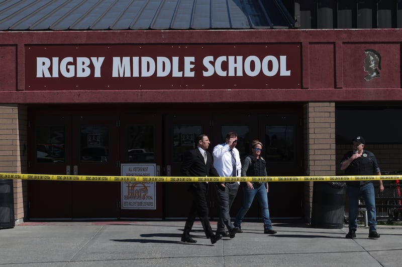 Authorities say a shooting at the eastern Idaho middle school has injured two students and a custodian, and a female student has been taken into custody.
