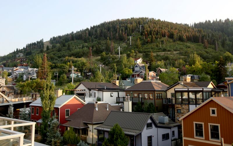 Treasure Hill rises behind homes in the Old Town neighborhood of Park City on Friday, Aug. 3, 2018. There is an open space initiative to save Treasure Hill from development, and Park City is pursing a bond for $48 million