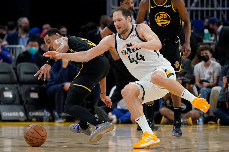 Utah Jazz forward Bojan Bogdanovic loses the ball after being fouled by Golden State Warriors guard Jordan Poole.