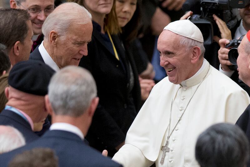 In this April 29, 2016, file photo Pope Francis shakes hands with Vice President Joe Biden at the Vatican.