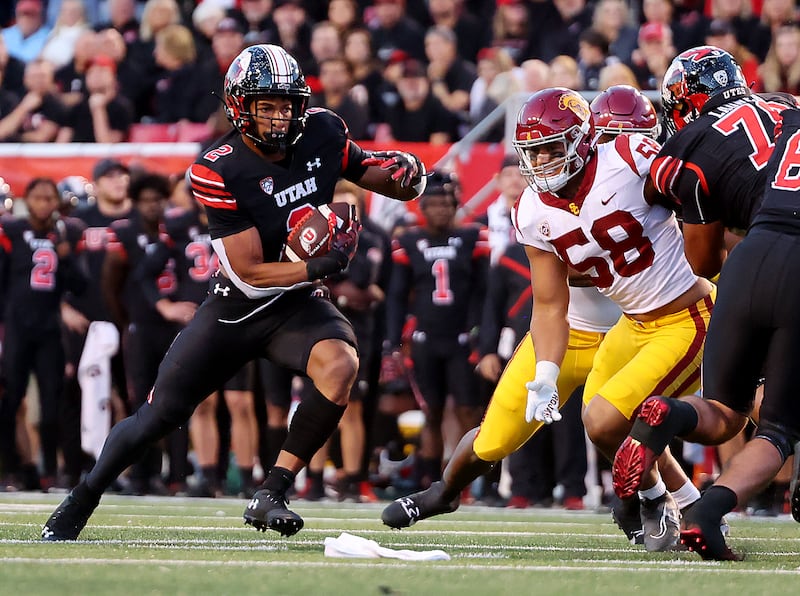 Utah running back Micah Bernard makes a cut into the line as Utah and USC play at Rice-Eccles Stadium in Salt Lake City.
