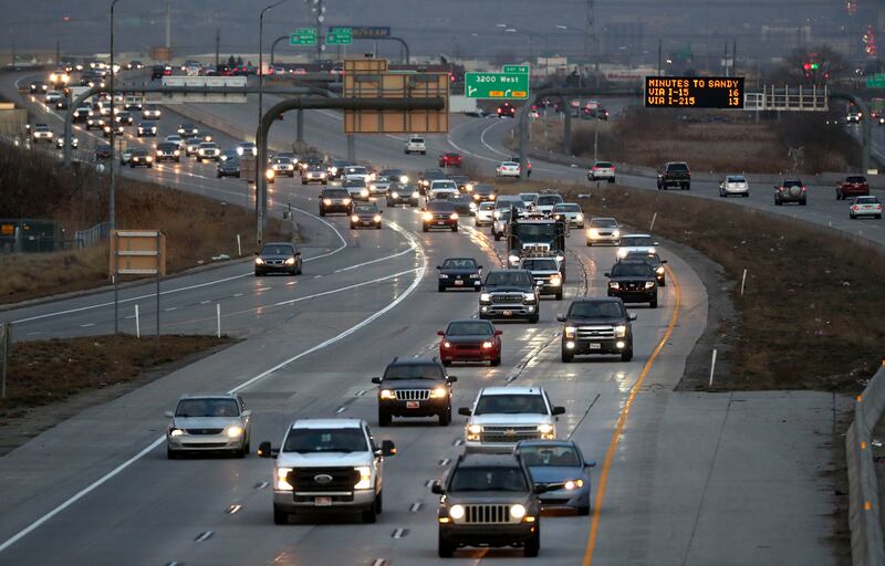 Traffic moves along state Route 201 during rush hour in Salt Lake City.