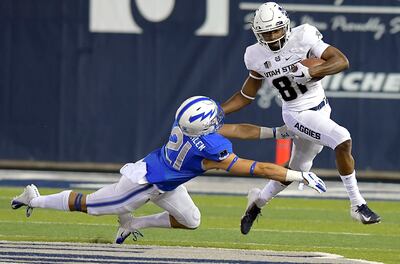 Utah State wide receiver Savon Scarver (81) stiff arms Air Force defensive back Bryce VonZurmuehlen (21) on a kickoff return during an NCAA college football game, Saturday, Sept. 22, 2018, in Logan, Utah.