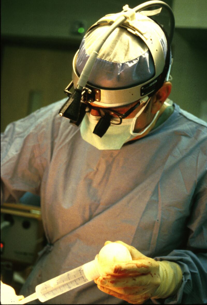 Dr. Russell M. Nelson is shown performing a medical procedure in 1982.