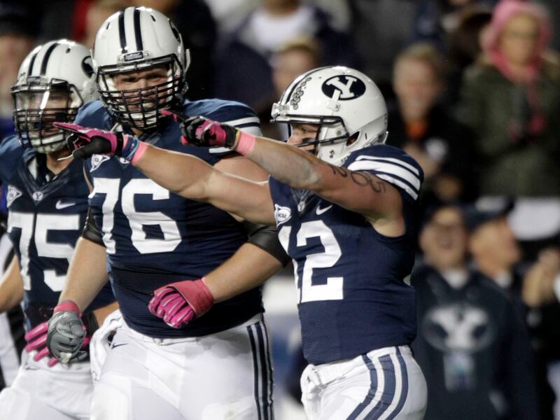 BYU’s JD Falslev celebrates a TD catch during victory over Utah State, Oct. 5, 2012, at LaVell Edwards Stadium.