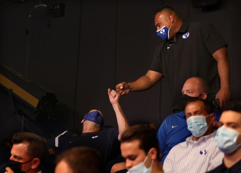 BYU football coach Kalani Sitake is congratulated at a press conference announcing that BYU has accepted an invitation to the Big 12 Conference.