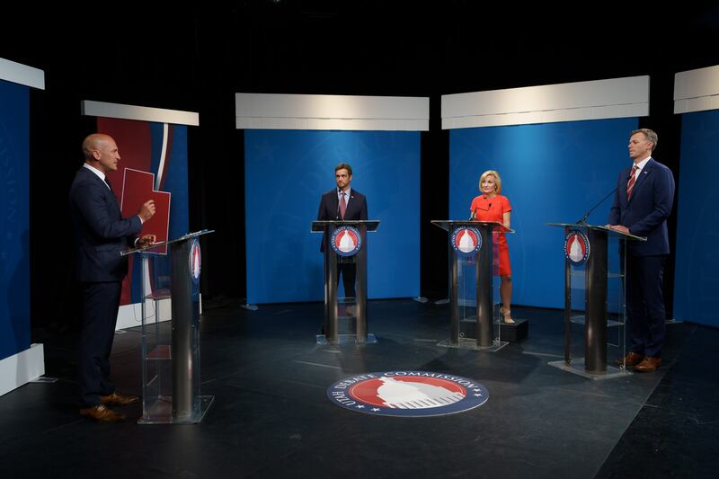 Andrew Badger, Tina Cannon and Rep. Blake Moore, R-Utah, take questions Thomas Wright during a GOP primary debate.