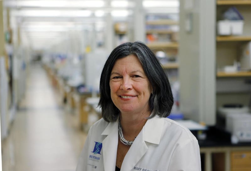 FILE: CEO and Director Mary Beckerle of Huntsman Cancer Institute poses for a photo in the lab at HCI in Salt Lake City, Wednesday, Jan. 15, 2014. Beckerle has been fired as CEO and director of the Huntsman Cancer Institute in a move that has drawn the ir