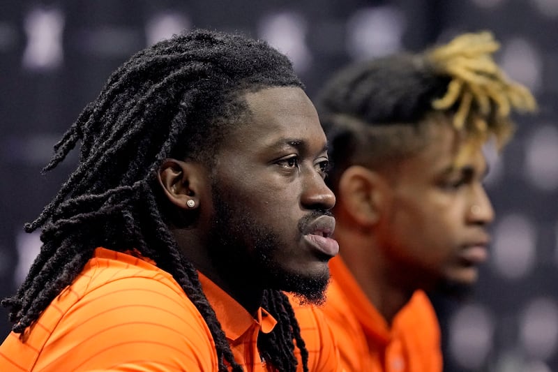 Oklahoma State’s Isaac Likekele Jr., left, and Rondel Walker speak during Big 12 media day in Kansas City, Mo.