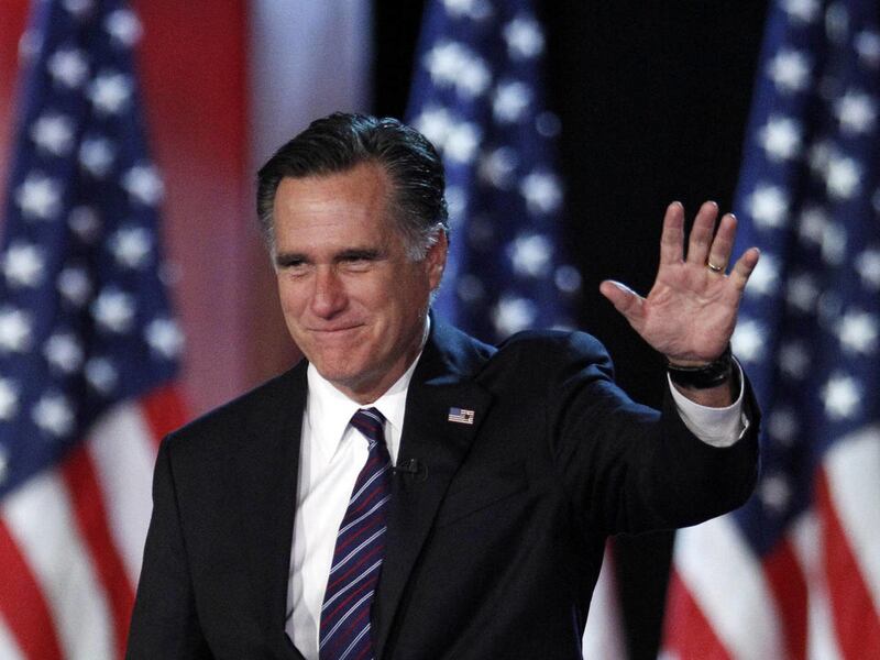 This file photo shows former Massachusetts Gov. Mitt Romney waving to supporters at an election night rally in 2012.