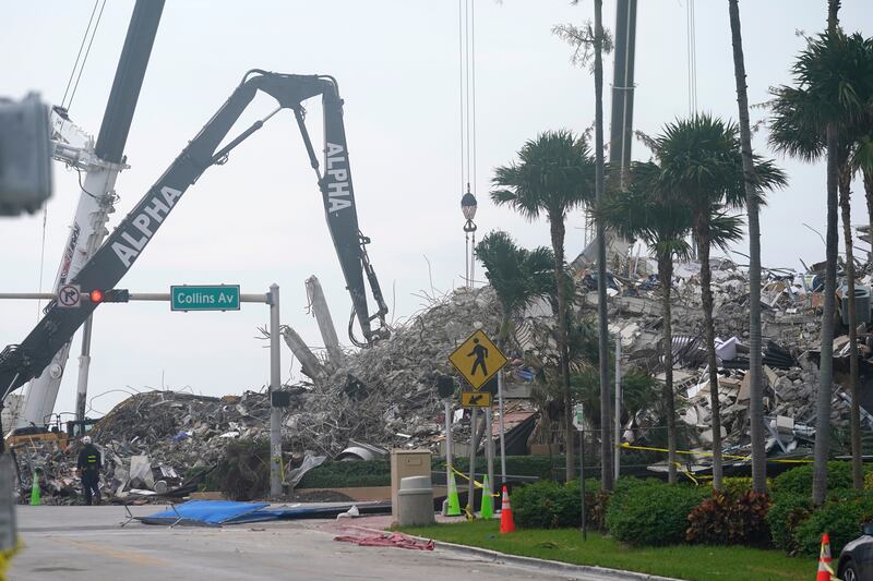 Rescue crews work in the rubble of the collapsed Champlain Towers South condominium building, Tuesday, July 6, 2021, in Surfside, Fla.