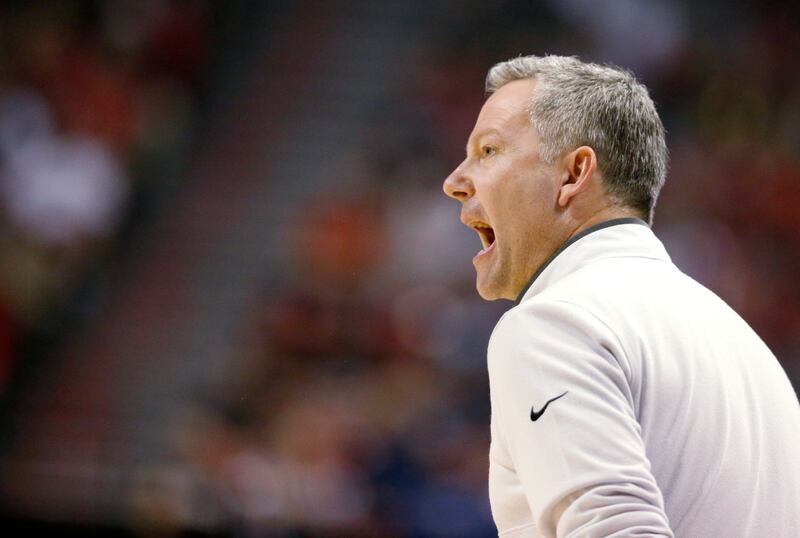 Utah State coach Ryan Odom calls out to players during a game against San Diego State in the MWC championship game.