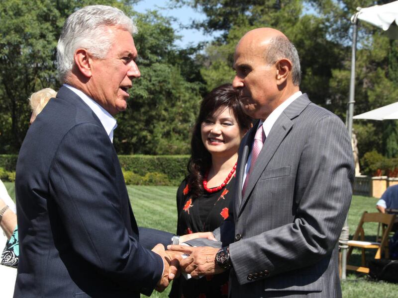 Dieter F. Uchtdorf, second counselor in the First Presidency of the Church of Jesus Christ of Latter-day Saints, greets Los Angeles Sheriff Lee Baca and his wife, Carol Baca. The Churchs Southern California Public Affairs Council recognized Sheriff Baca o