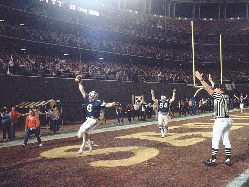 Steve Young celebrates in the end zone after scoring the game-winning touchdown to beat Missouri in the 1983 Holiday Bowl.