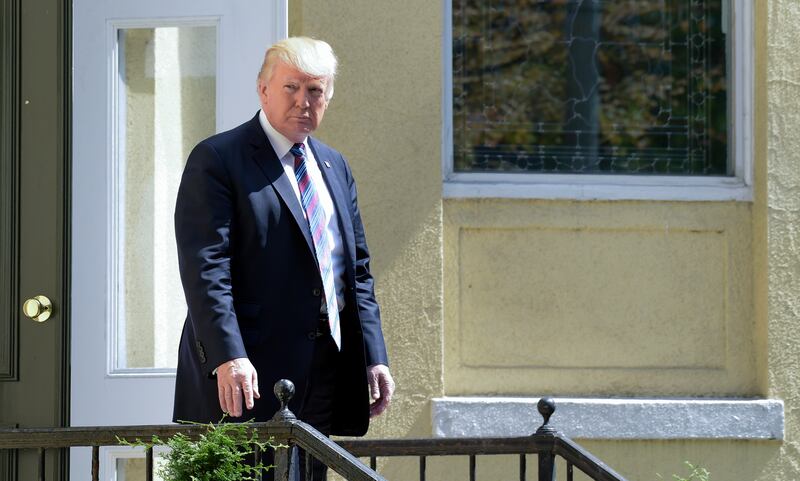 FILE - President Donald Trump leaves after attending services at St. John's Church in Washington, Sunday, Sept. 3, 2017. The president last week named today a National Day of Prayer for victims of Hurricane Harvey. Trump is expected to announce that he wi