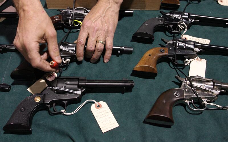 Alan Rogers, of Ashman’s Pioneer Market in Fillmore, sets up for the 2008 Crossroads of the West gun show in Sandy.