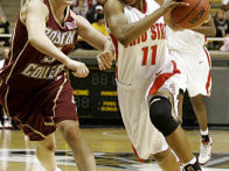 Ohio State's Kim Wilburn, right, drives to the basket against Boston College's Sarah Marshall during the first half of their NCAA second-round women's basketball tournament game Tuesday.