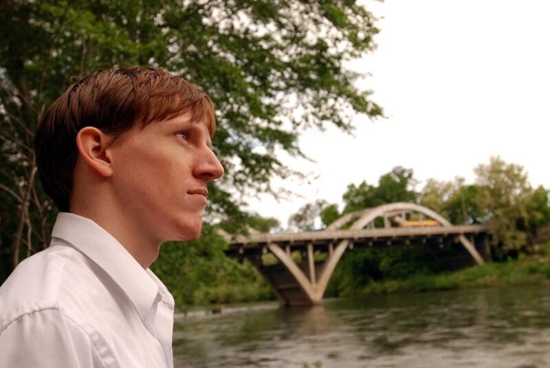 Oregon State University graduate Josh Donahue, 23, stands at the edge of the Rogue River in his home town of Grants Pass, Ore., Tuesday, May 19, 2009. A new Pew study shows that the number of young adults — ages 18 to 31 — who live with their parents cont