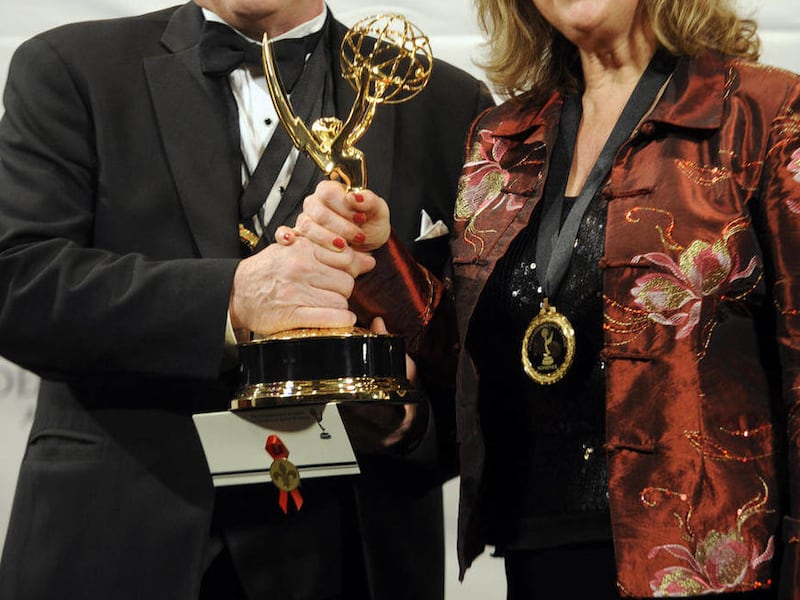 John Kastner, left, and Sylva Basmajian pose with the Documentary award for the Canadian film "Life with Murder" at the 39th International Emmy Awards, on Monday, Nov. 21, 2011 in New York.