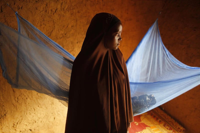 Zali Idy, 12, poses in her bedroom in the remote village of Hawkantaki, Niger. Zali has been married since 2011.