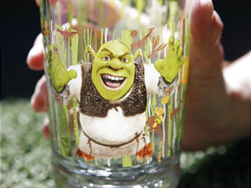 A "Shrek" glass is displayed. Cadmium has been discovered in the design on glasses being sold at McDonald's.