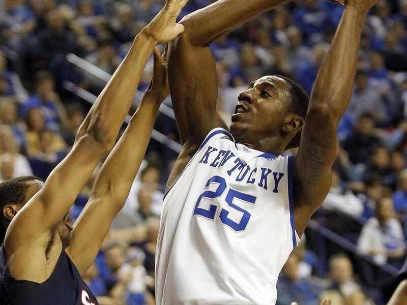 FILE - This Dec. 20, 2011 file photo shows Kentucky's Marquis Teague (25) shooting under pressure from Samford's Raijon Kelly during the first half of an NCAA college basketball game in Lexington, Ky. Teague is a possible pick in the NBA Draft on June 28.