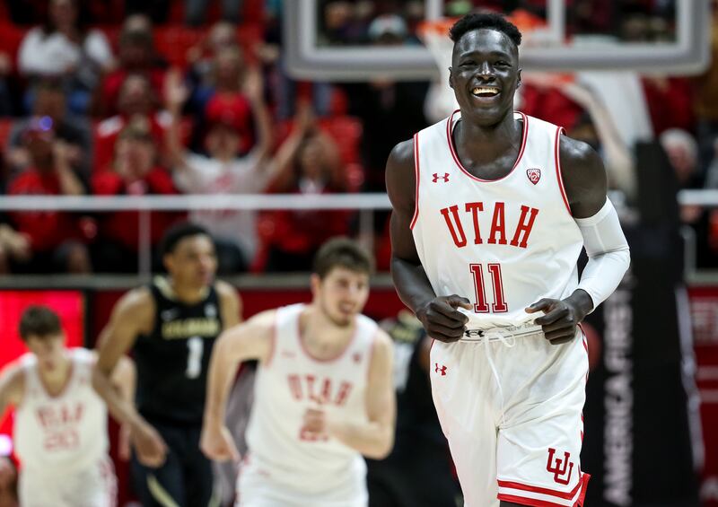 Utah Utes guard Both Gach (11) celebrates after hitting a 3-pointer. Gach is transferring back to Utah after a year at Minnesota.