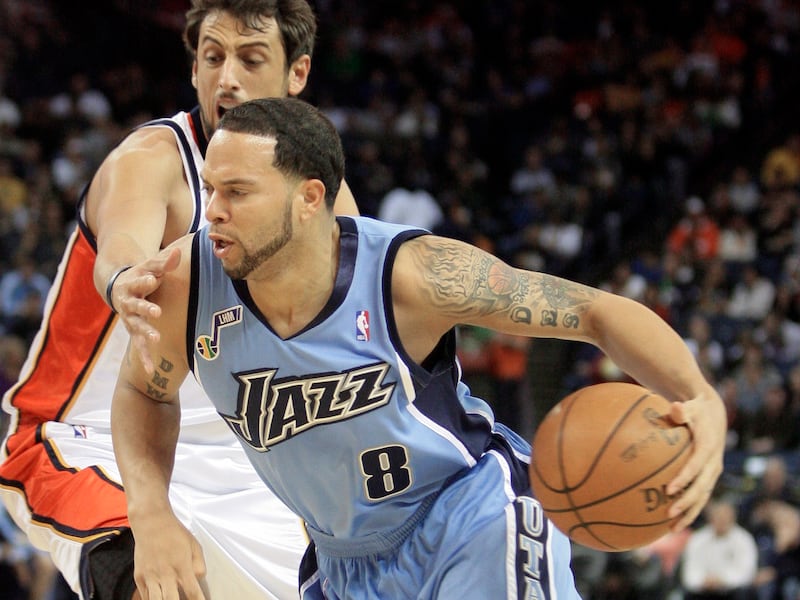Utah Jazz’ Deron Williams (8) drives past Golden State Warriors’ Marco Belinelli during the first half of an NBA basketball game Sunday, March 1, 2009, in Oakland, Calif. (AP Photo/Ben Margot)