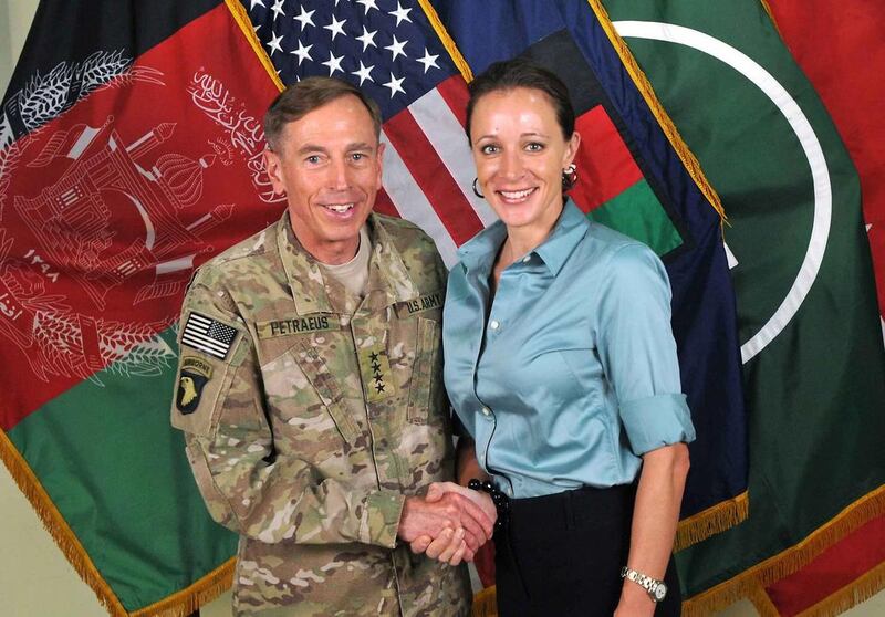 This July 13, 2011, photo made available on the International Security Assistance Force's Flickr website shows the former Commander of International Security Assistance Force and U.S. Forces-Afghanistan Gen. Davis Petraeus, left, shaking hands with Paula