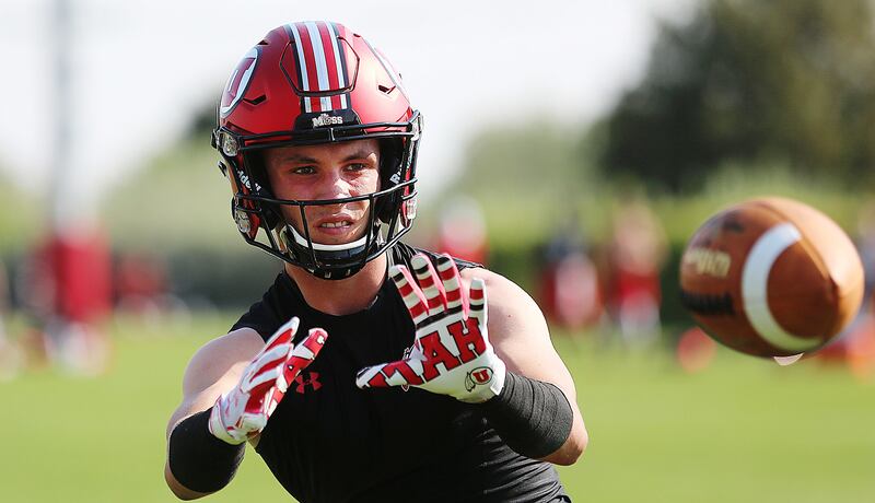 Britain Covey works on catching drills as the Utes open fall camp in Salt Lake City on Wednesday, Aug. 1, 2018.