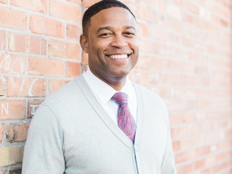 A portrait of Ronell Hugh.