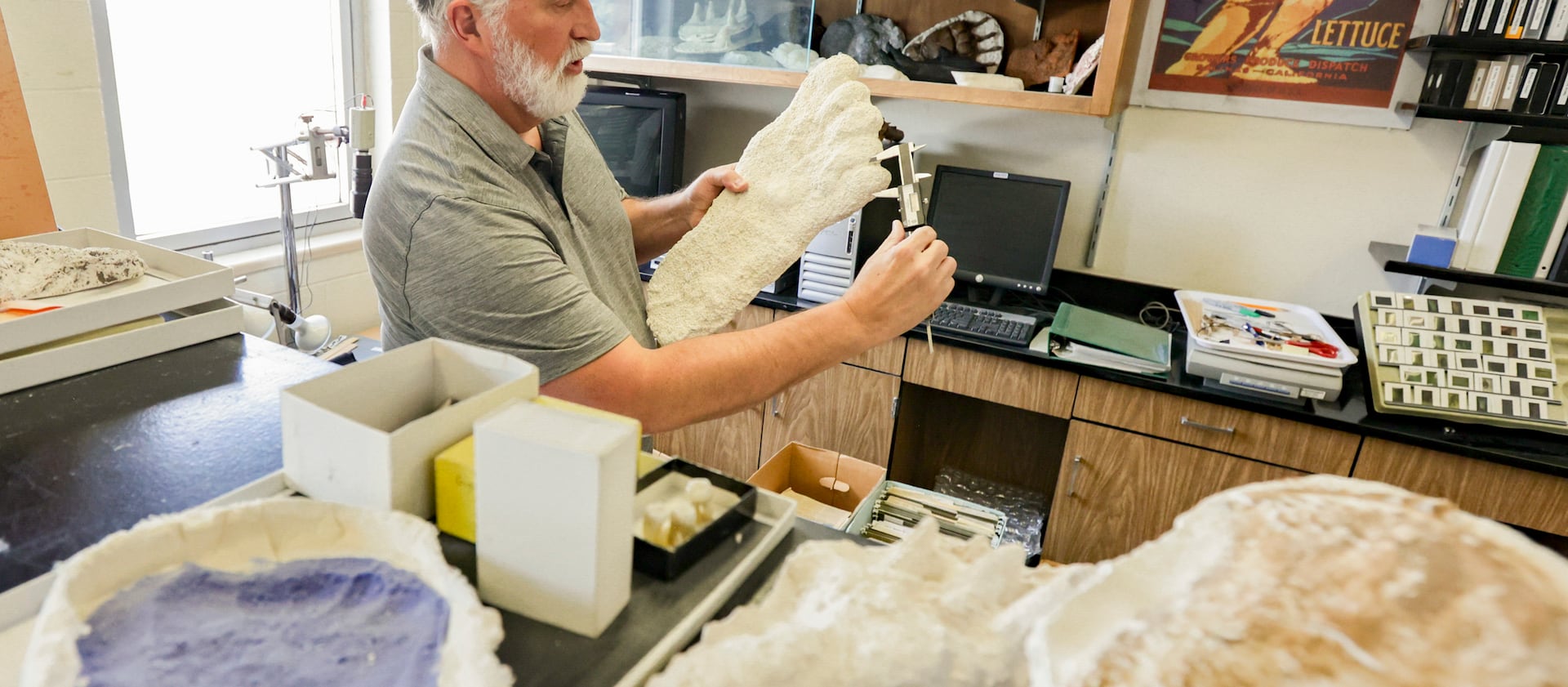 Jeffrey Meldrum, a professor of anatomy and anthropology who has been researching a publishing studies on Sasquatch for decades, measures a footprint at Idaho State University.