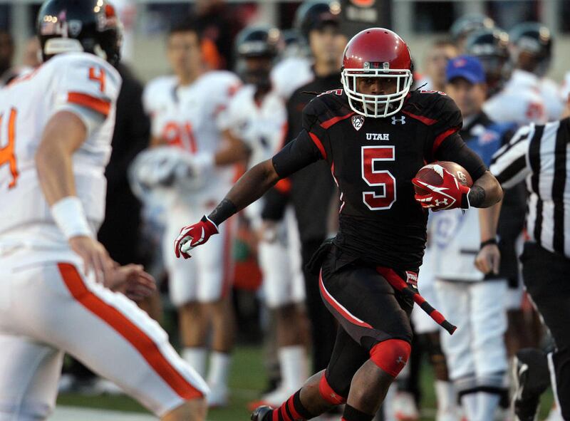 Utah Utes defensive back Mo Lee runs after intercepting the ball during PAC-12 action in Salt Lake City Saturday, Oct. 29, 2011.