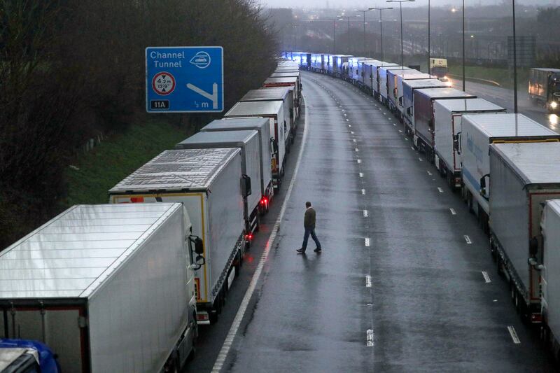 Lorries are parked on the M20 near Folkestone, Kent, England as part of Operation Stack after the Port of Dover was closed and access to the Eurotunnel terminal suspended following the French government’s announcement, Monday, Dec. 21, 2020.