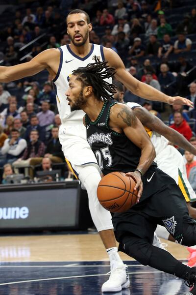 Minnesota Timberwolves' Derrick Rose drives around Utah Jazz's Rudy Gobert during the second half of an NBA basketball game Wednesday, Oct. 31, 2018, in Minneapolis. Rose led the Timberwolves with 50 points, a career high, in the Timberwolves' 128-125 win