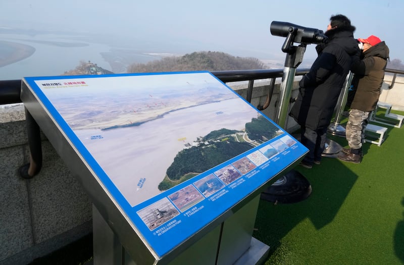 Visitors watch the North Korea side from the Unification Observation Post in Paju, South Korea, on Jan. 10, 2024.