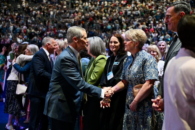 Elder David A. Bednar of the Quorum of the Twelve Apostles greets attendees during the closing keynote for BYU Women's Conference in the Marriott Center in Provo, Utah, on Friday, May 1, 2026.