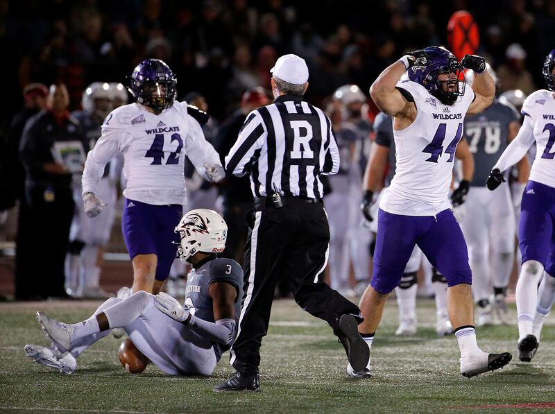 Weber State defensive lineman Cardon Malan celebrates sacking Southern Utah quarterback Patrick Tyler during game in Cedar City on Saturday, Dec. 2, 2017.