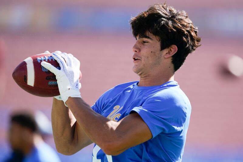 UCLA wide receiver Braden Pegan catches a ball during warm ups before a game against Washington State, Saturday, Oct. 7, 2023, in Pasadena, Calif.