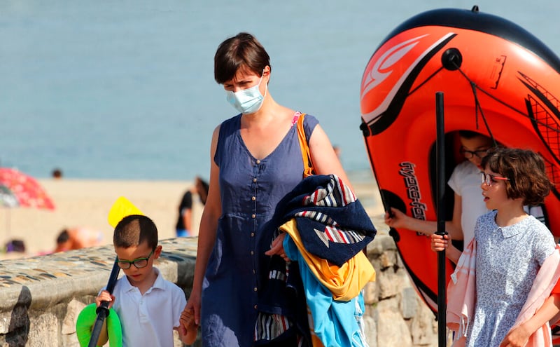 A woman wearing face masks to protect against the delta variant.