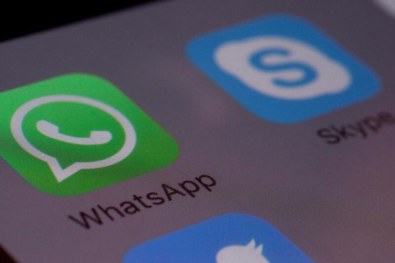This Saturday, April 9, 2016 photo shows the icons for WhatsApp and Skype apps on a smartphone in New York. (AP Photo/Patrick Sison)