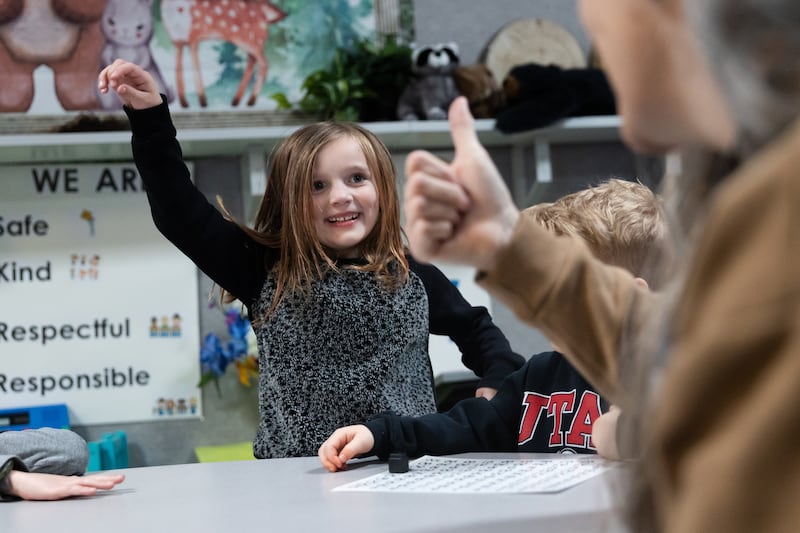 River McIver celebrates answering correctly during a full-day kindergarten class at East Sandy Elementary School.