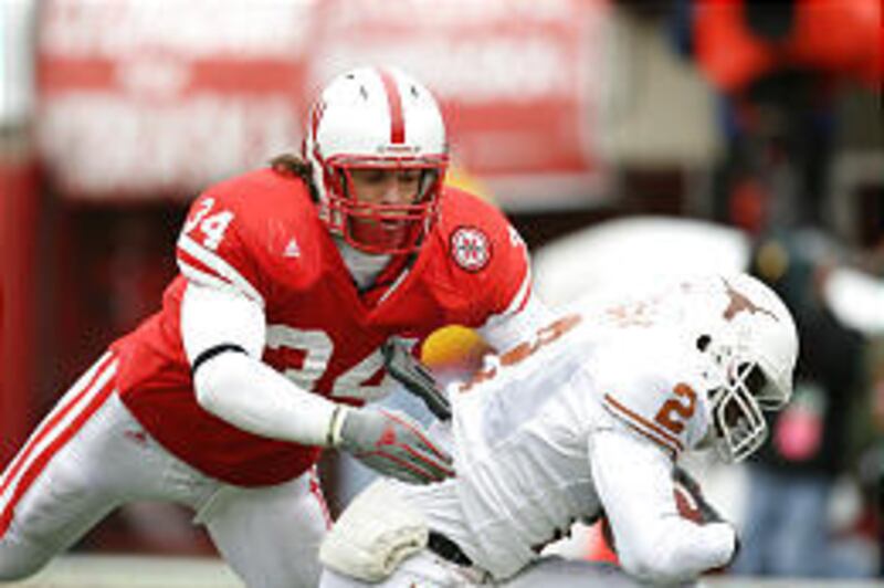 Nebraska linebacker Stewart Bradley makes a tackle against Texas. The ex-Highland player will play in the Big 12 title game Saturday.