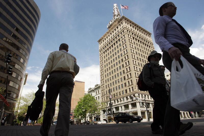 Pedestrians walk on Main Street in downtown Salt Lake City Tuesday, May 7, 2013. Salt Lake City and Orem-Provo have been listed by Forbes as some of the best cities for jobs.