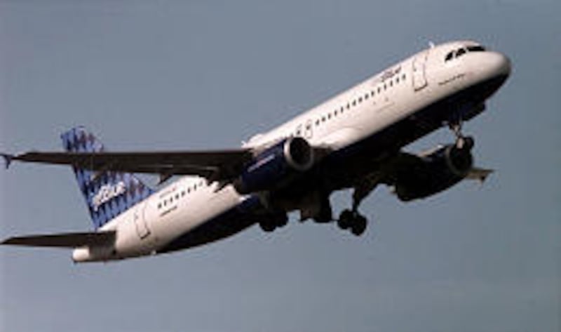 A JetBlue flight leaves South Burlington, Vt., in 2000. JetBlue Airways saw its profits fall sharply in the fourth quarter.