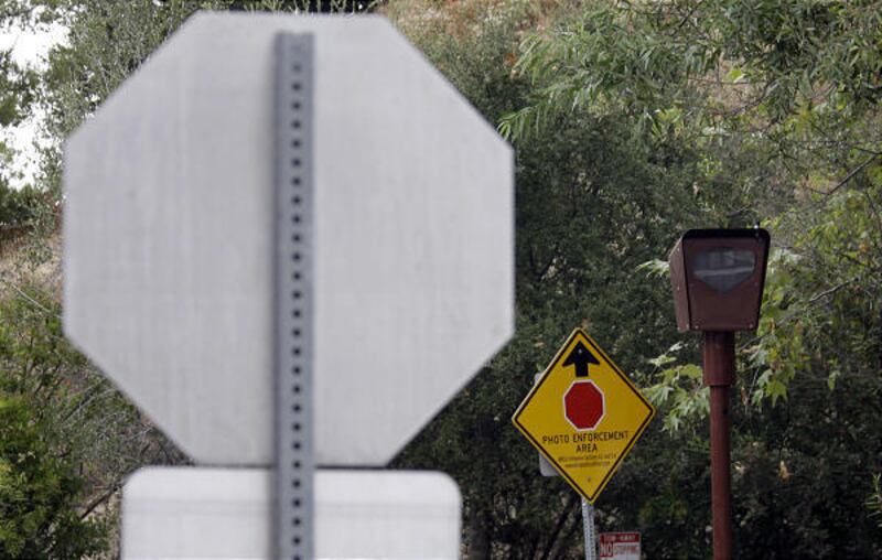 A photo-enforced stop sign camera at the Top Of Topanga overlook in Topanga, Calif., and others like it are increasingly stirring controversy.