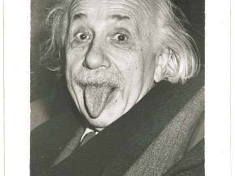 One of the original signed prints of Albert Einstein sticking his tongue out at photographers has been sold by a New Hampshire auction house for $74,324. Bobby Livingston, of RRAuction.com, says it was taken in 1951 after a party for Einstein.