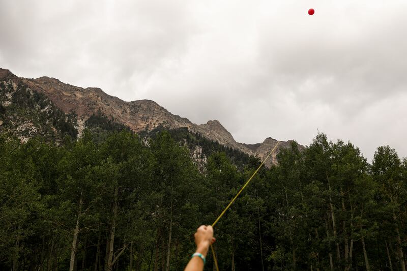 A demonstrator flies a balloon in Little Cottonwood Canyon to demonstrate how erecting poles for a gondola would impact views inside the canyon on Saturday, Aug. 21, 2021, in Sandy.