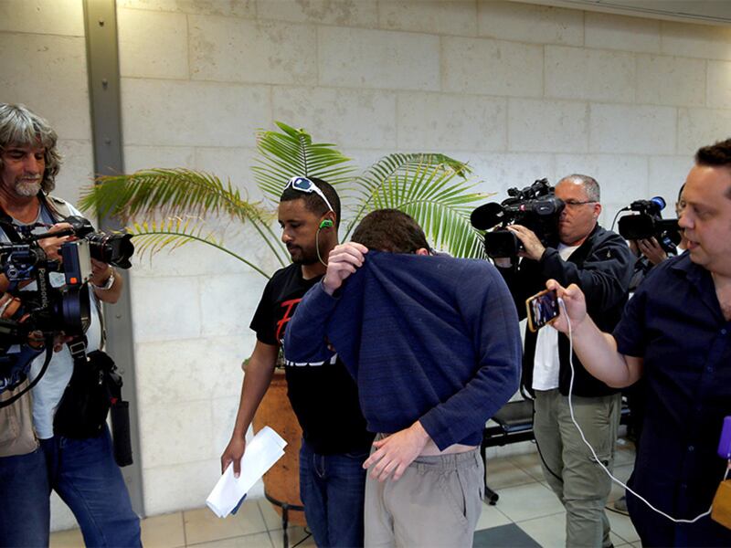 A U.S.-Israeli teen who was arrested in Israel on suspicion of making bomb threats against Jewish community centers in the United States, Australia and New Zealand over the past three months is seen before the start of a remand hearing at Magistrate's Cou